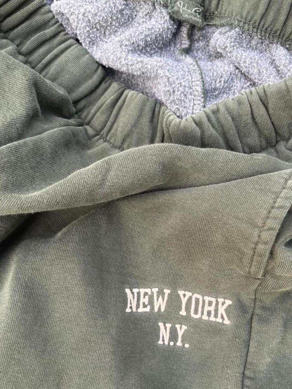 Green Brandy Melville joggers with embroidered New York N.Y. text